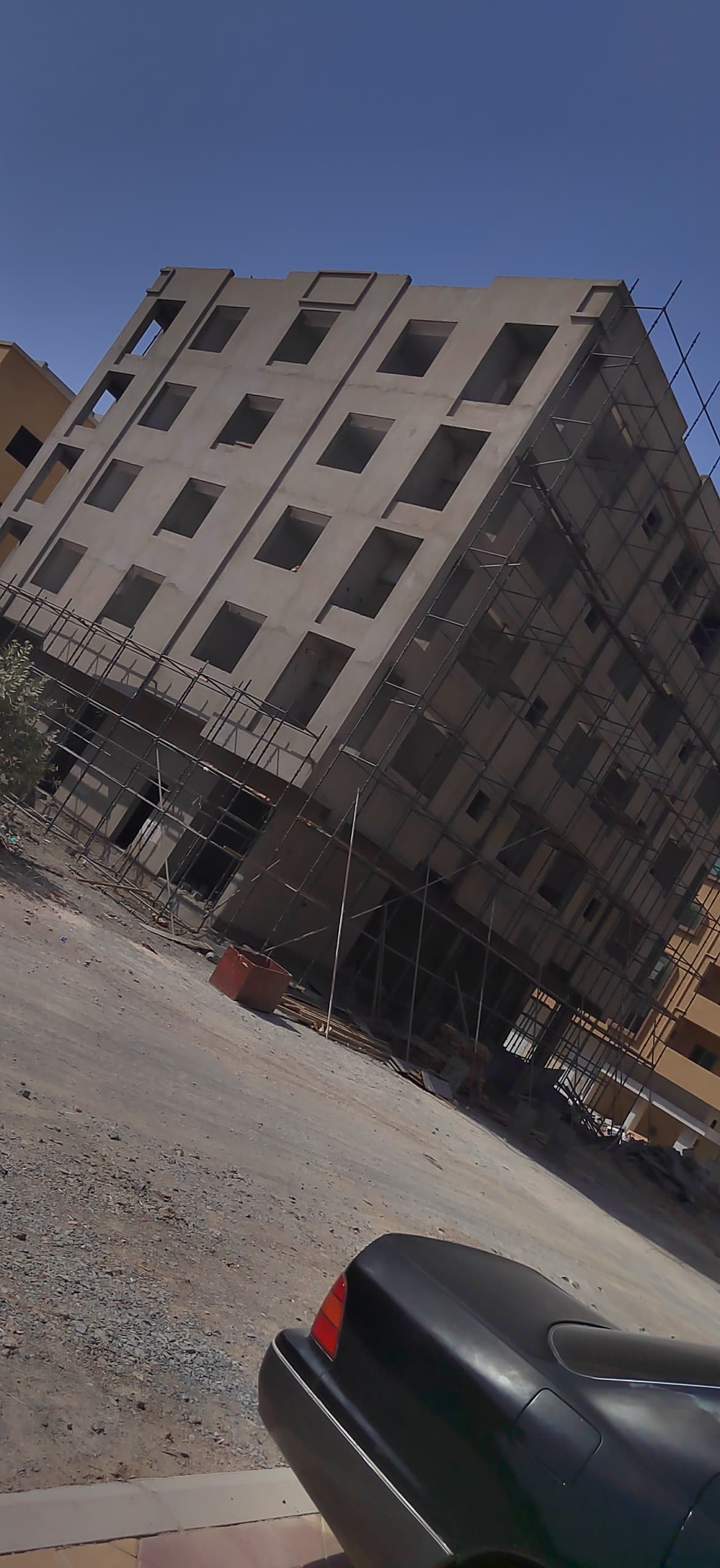 A sixteen-unit two-bedroom flat building with ground-floor offices — view 3